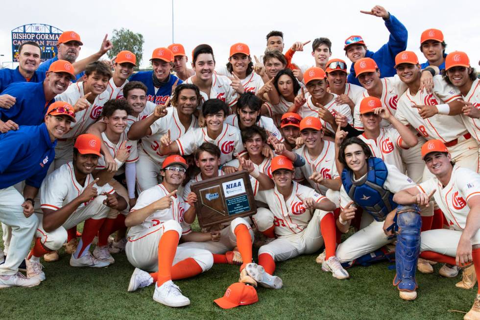 Bishop Gorman High School players celebrate their victory against Palo Verde in the Class 5A re ...