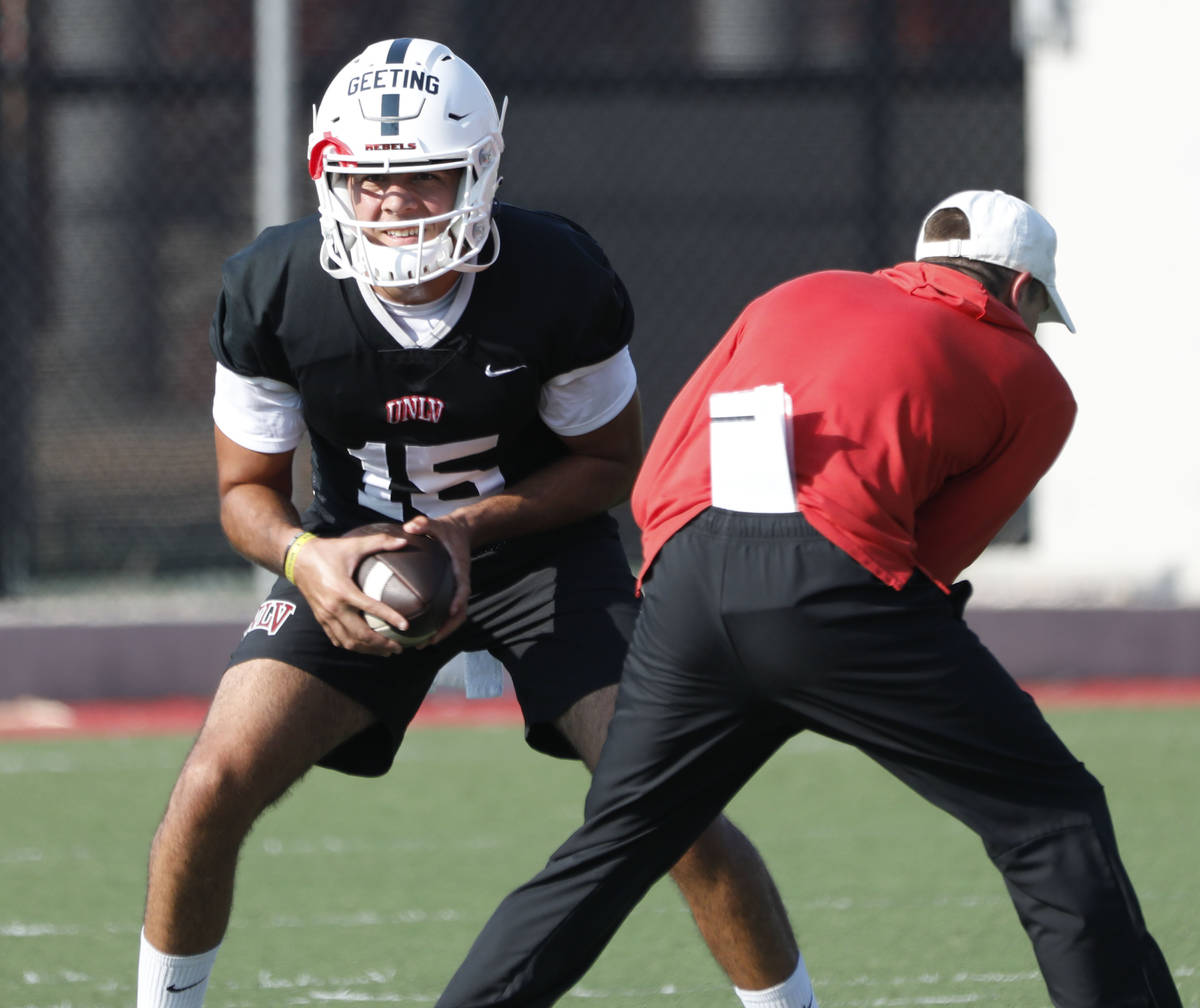 UNLV Rebels quarterback Matthew Geeting (15) looks to throw the ball during football practice i ...