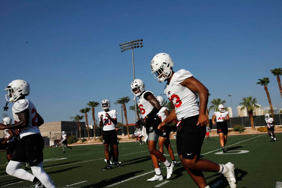 UNLV Rebels players run during football practice in UNLV, Wednesday, Aug. 4, 2021, in Las Vegas ...