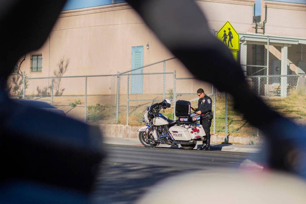 Officer Chris Deuel of "Fab Five," the five-member traffic unit of Clark County Schoo ...