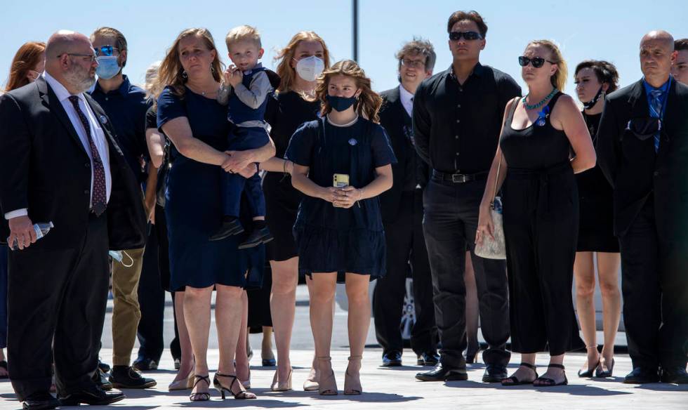 Family members watch as Nevada Highway Patrol trooper Micah May's casket is moved into his memo ...