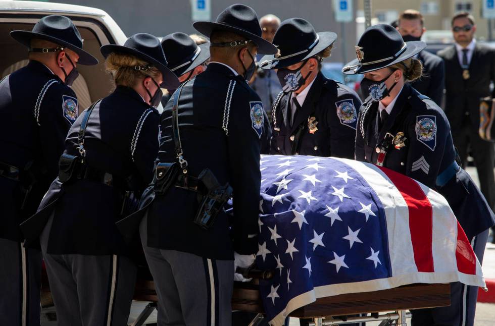 Members of the Honor Guard move Nevada Highway Patrol trooper Micah May's casket into his memor ...