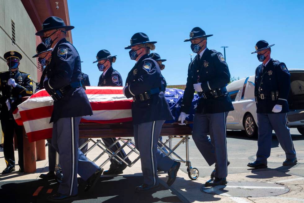 Members of the Honor Guard move Nevada Highway Patrol trooper Micah May's casket into his memor ...