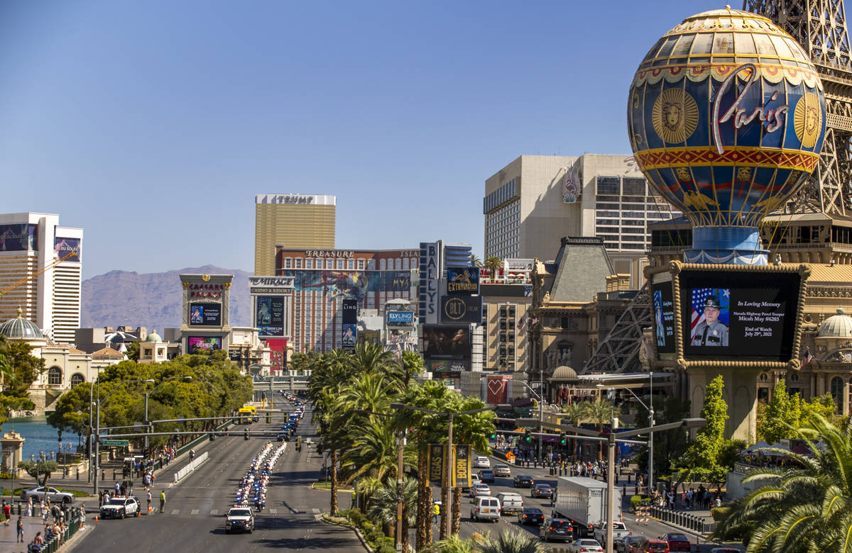 The processional for Nevada Highway Patrol trooper Micah May makes its way down the Strip on Fr ...