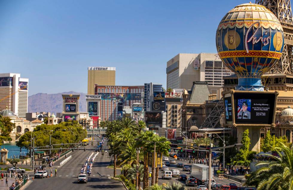 The processional for Nevada Highway Patrol trooper Micah May makes its way down the Strip on Fr ...