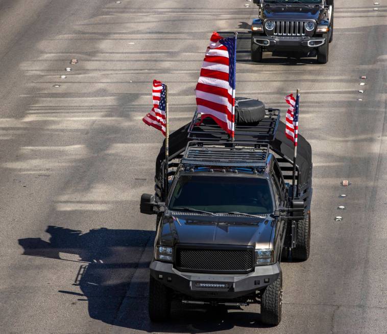 An armored vehicle flies American flags within the processional for Nevada Highway Patrol troop ...