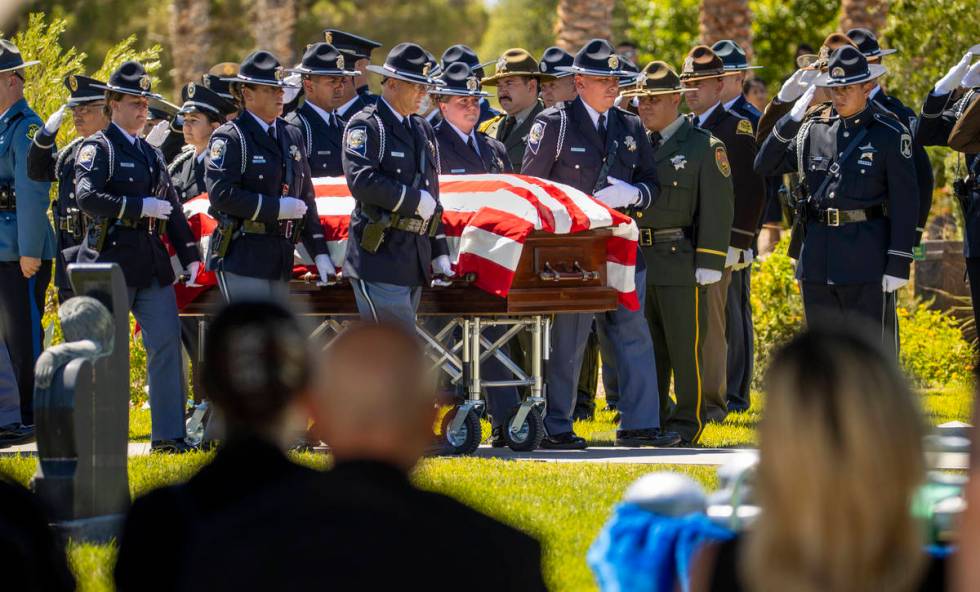 Members of the Nevada Department of Public Safety Honor Guard bring in the casket during a grav ...