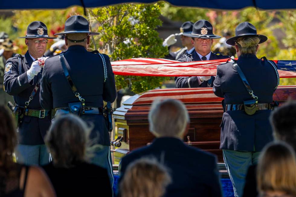 Members of the Nevada Department of Public Safety Honor Guard fold the American flag above the ...