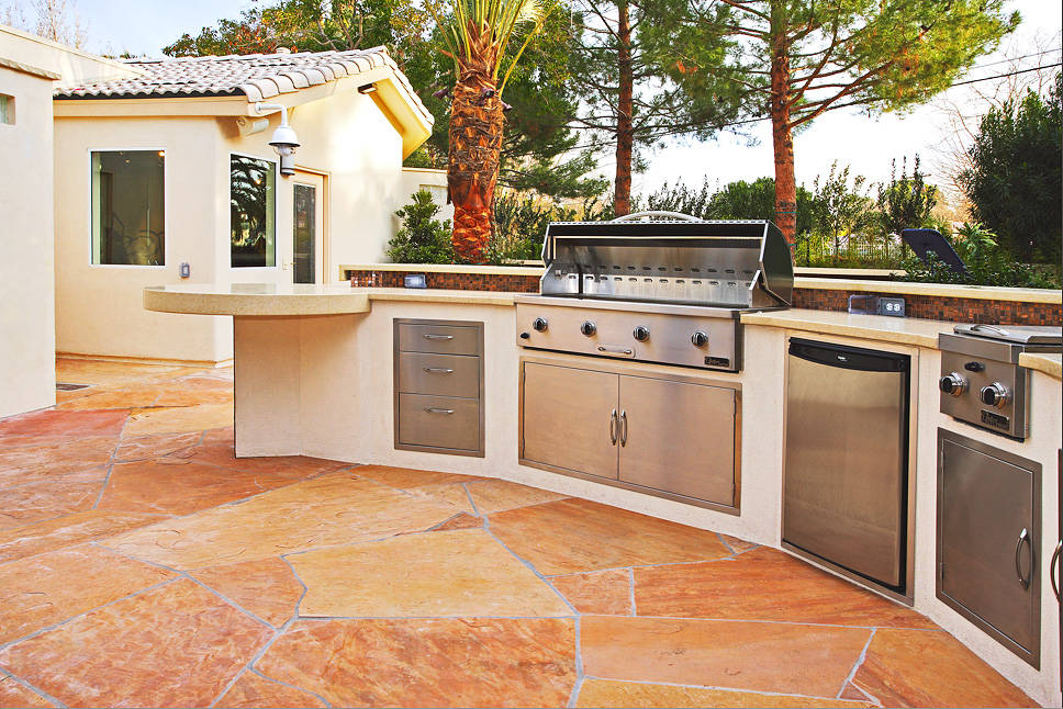 Outdoor kitchens are getting smaller but packed with more luxury and high-end features. (Ozzie ...