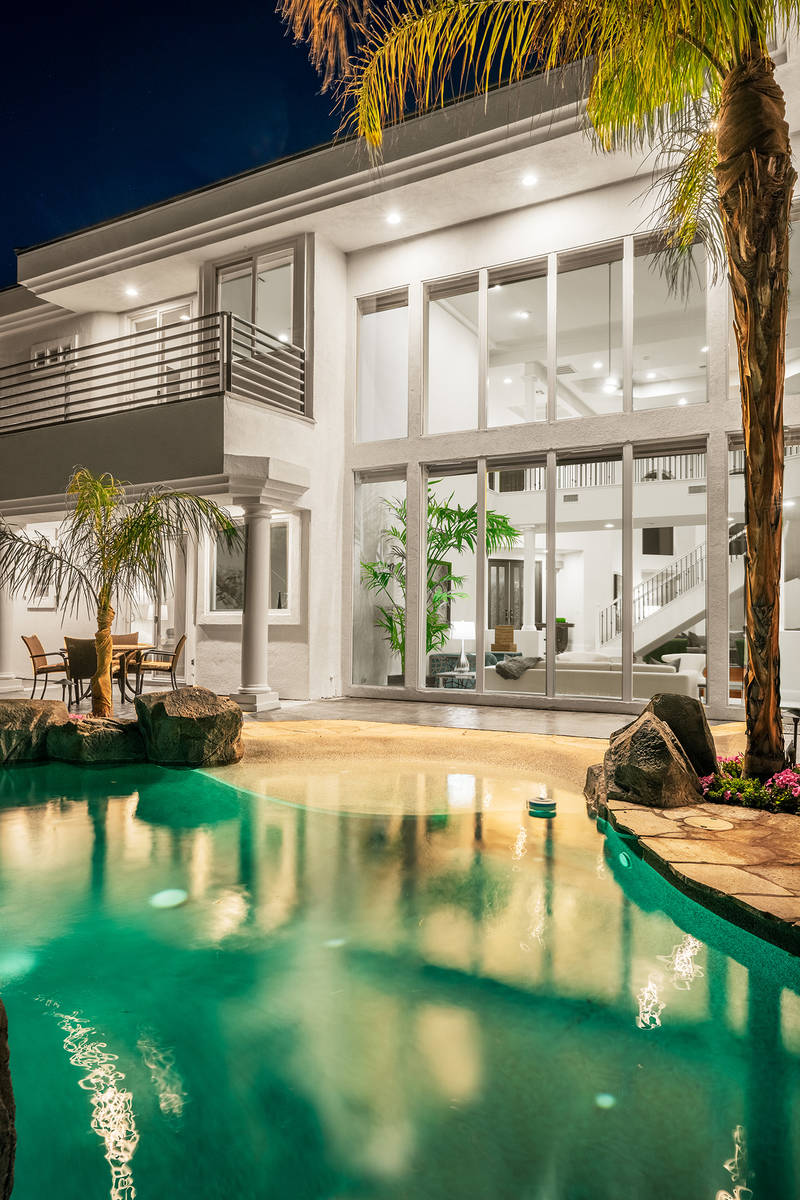The owners of this luxury home at 2000 Bogart Court created a beach resort vacation feel for it ...