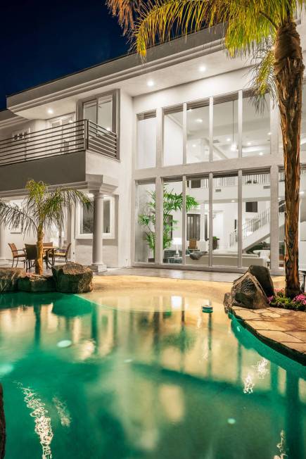 The owners of this luxury home at 2000 Bogart Court created a beach resort vacation feel for it ...