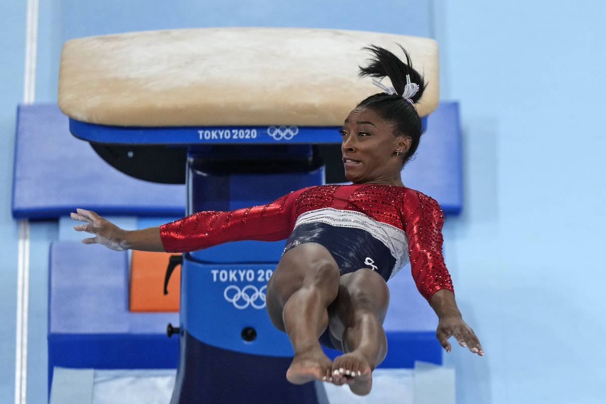 FILE - In this July 27, 2021 file photo, Simone Biles, of the United States, performs on the va ...