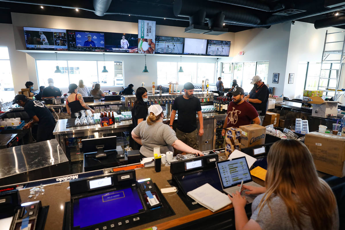 Employees work on the finishing touches of the new PKWY Tavern in Henderson, near St. Rose Park ...