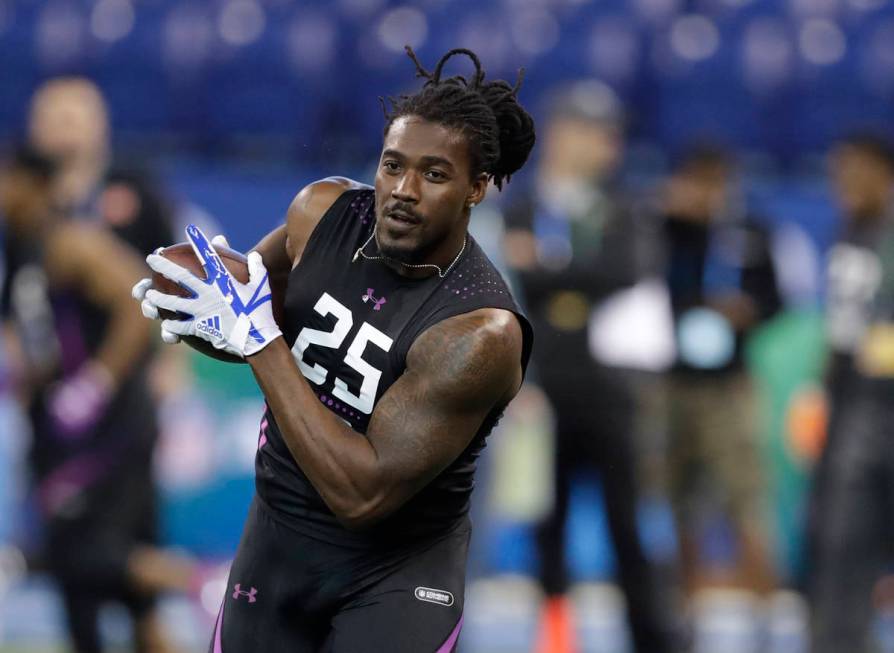 Alabama running back Bo Scarbrough runs a drill during the NFL football scouting combine, Frida ...