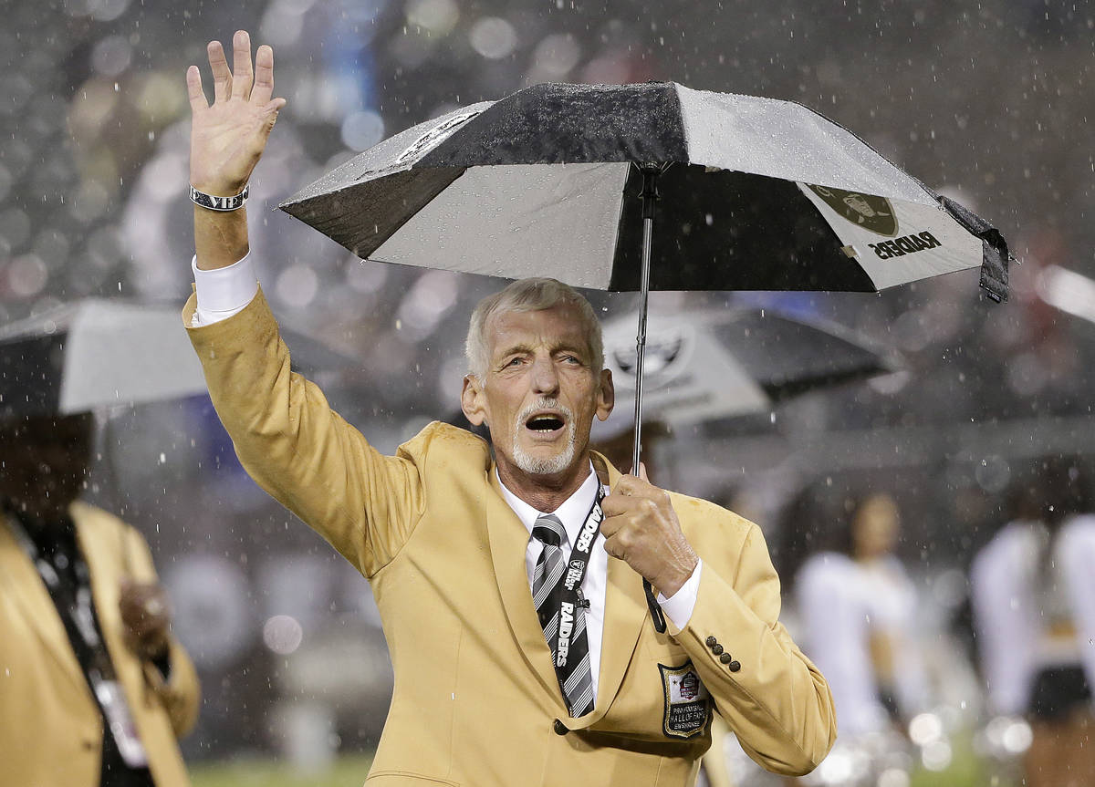 Former Oakland Raiders punter Ray Guy waves during a ceremony honoring his induction into the P ...