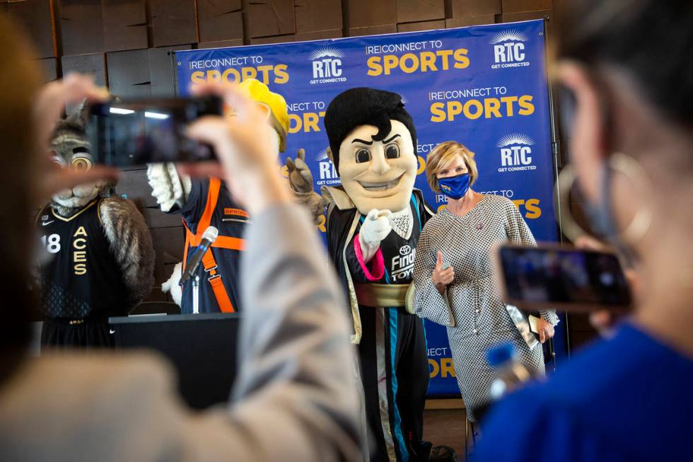 Rep. Susie Lee, D-Nev., poses with mascots at a Regional Transportation Commission (RTC) of Sou ...