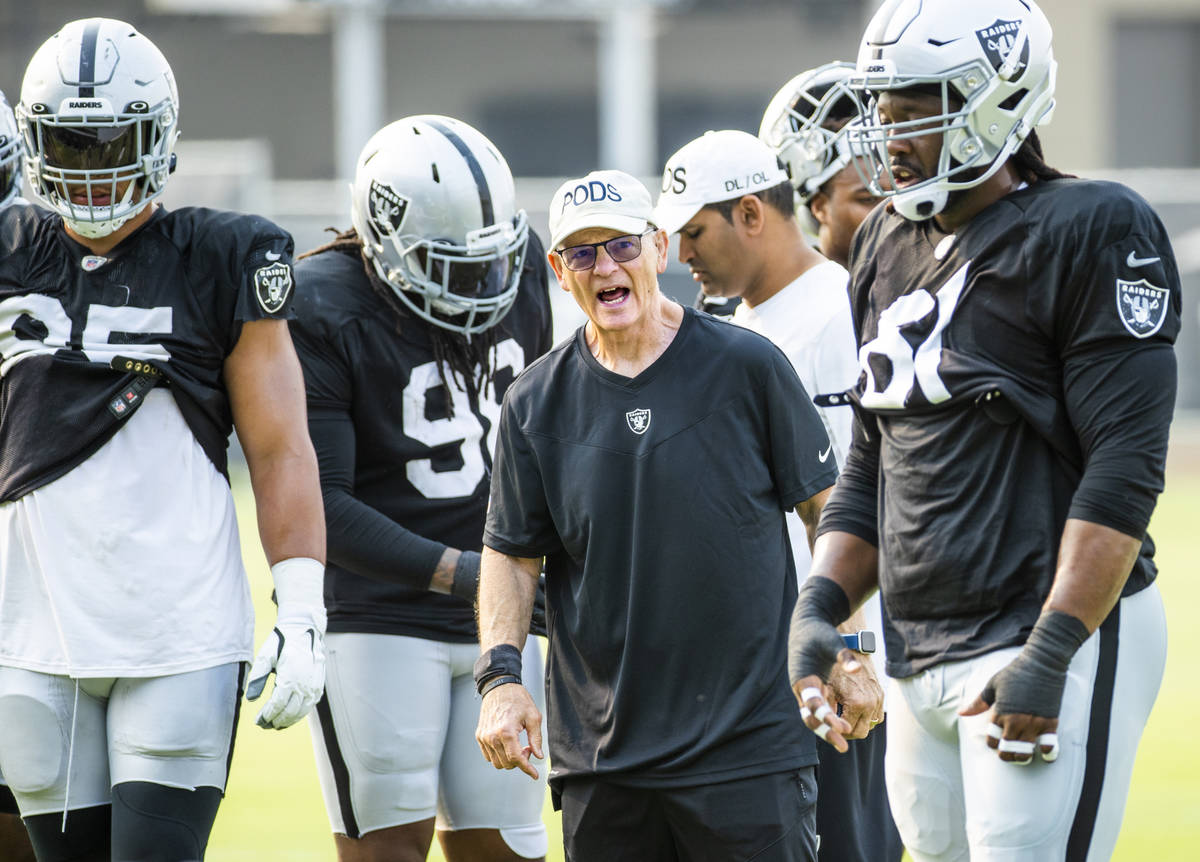 Raiders defensive line coach Rod Marinelli yells instructions to his players during practice at ...
