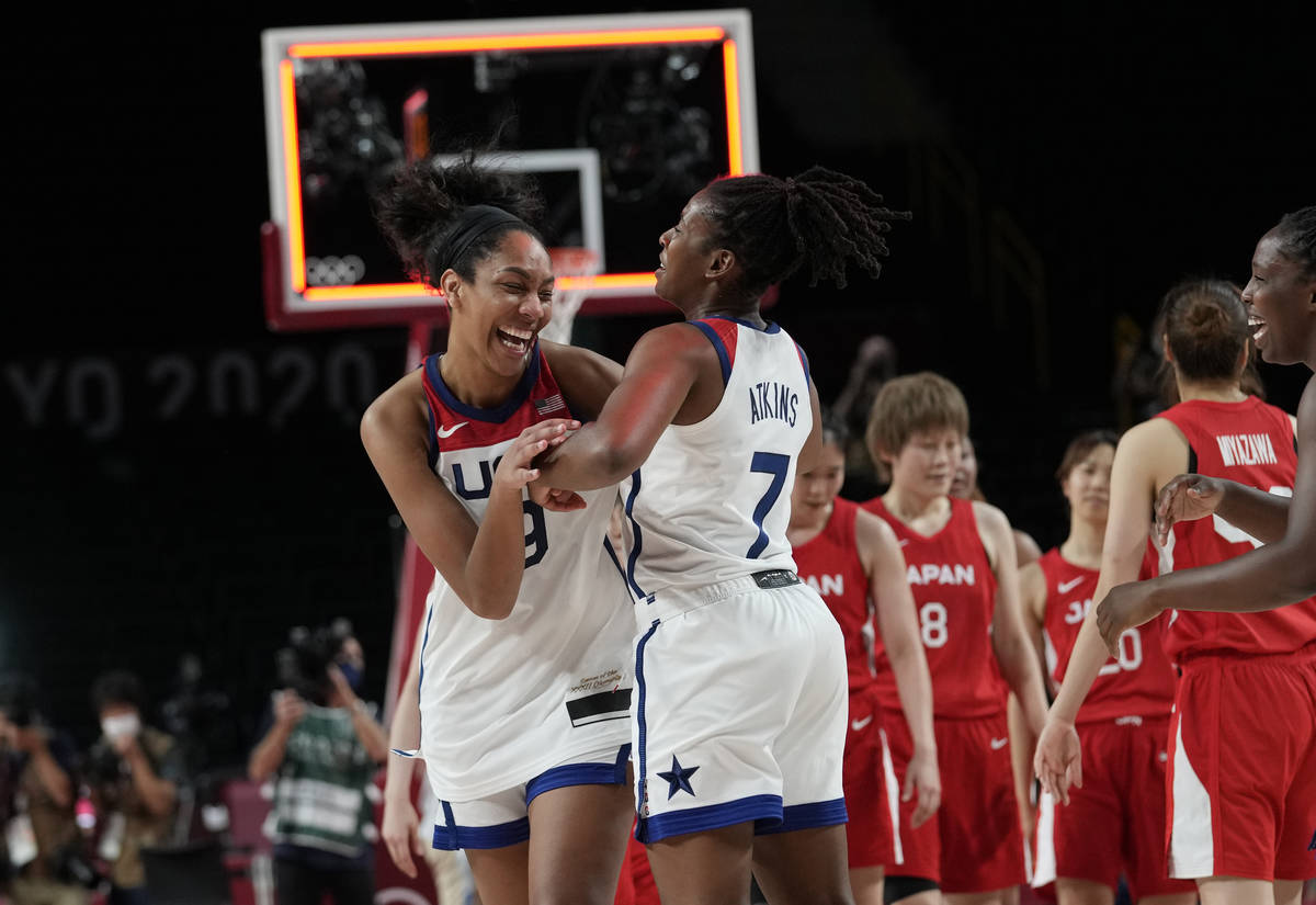 United States's A'Ja Wilson (9) and Ariel Atkins (7) celebrate after their win in the women's b ...