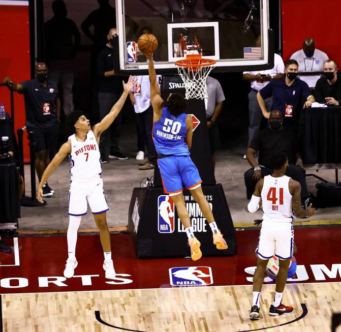 Oklahoma City's Jeremiah Robinson-Earl (50) goes to the basket against Detroit's Killian Hayes ...