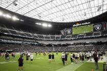 The Raiders scrimmage during a special training camp practice for season ticket holders, team e ...
