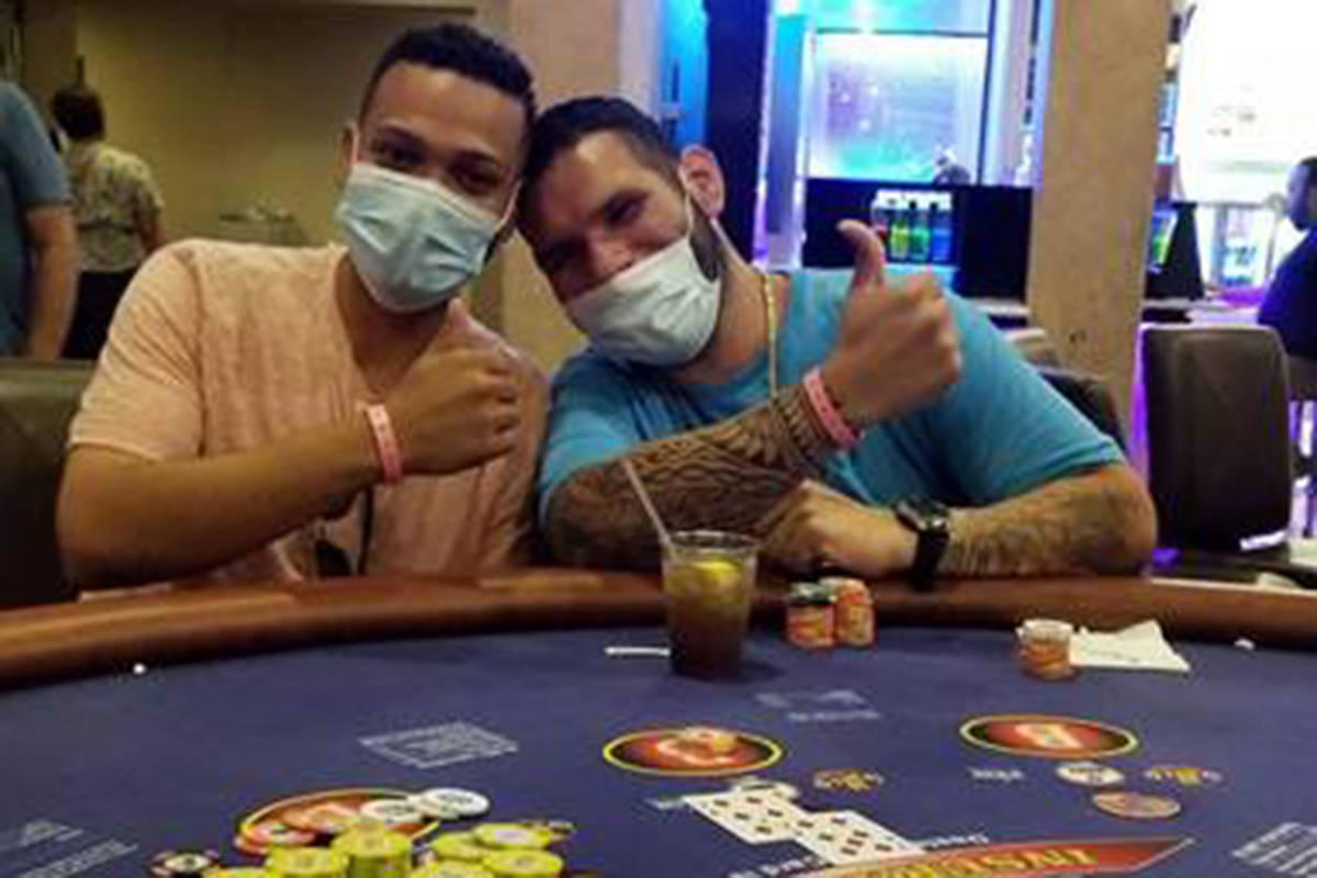 Brian Rodriguez celebrates with a friend after hitting a jackpot at Bally's. (Caesars Entertain ...