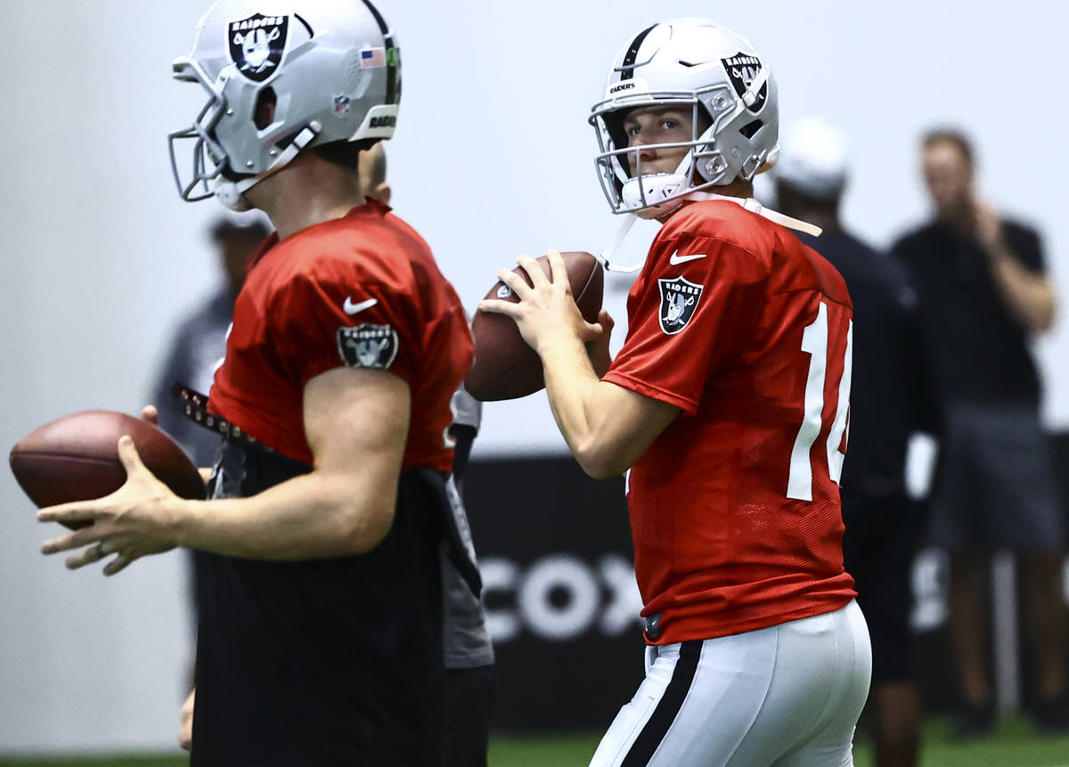 Raiders quarterback Case Cookus looks to throw a pass during training camp at Raiders Headquart ...