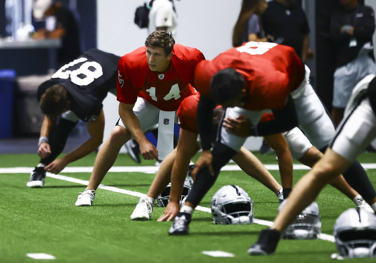 Raiders quarterback Case Cookus (14) stretches during training camp at Raiders Headquarters/Int ...