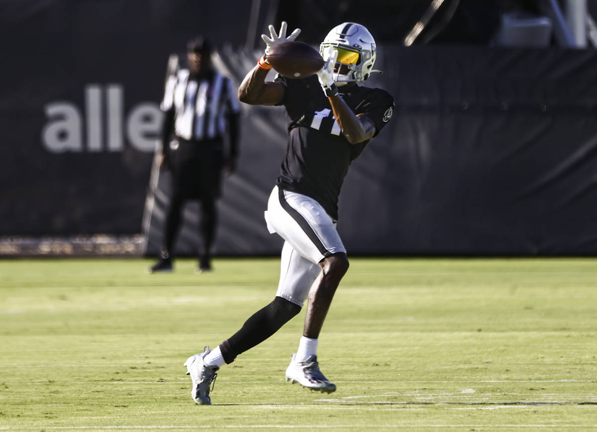 Raiders wide receiver Henry Ruggs III catches a pass during training camp at Raiders Headquarte ...