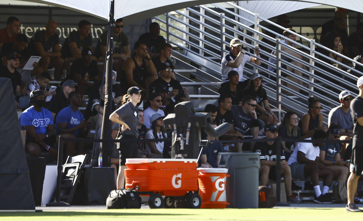 People, including active-duty military, watch training camp at Raiders Headquarters/Intermounta ...