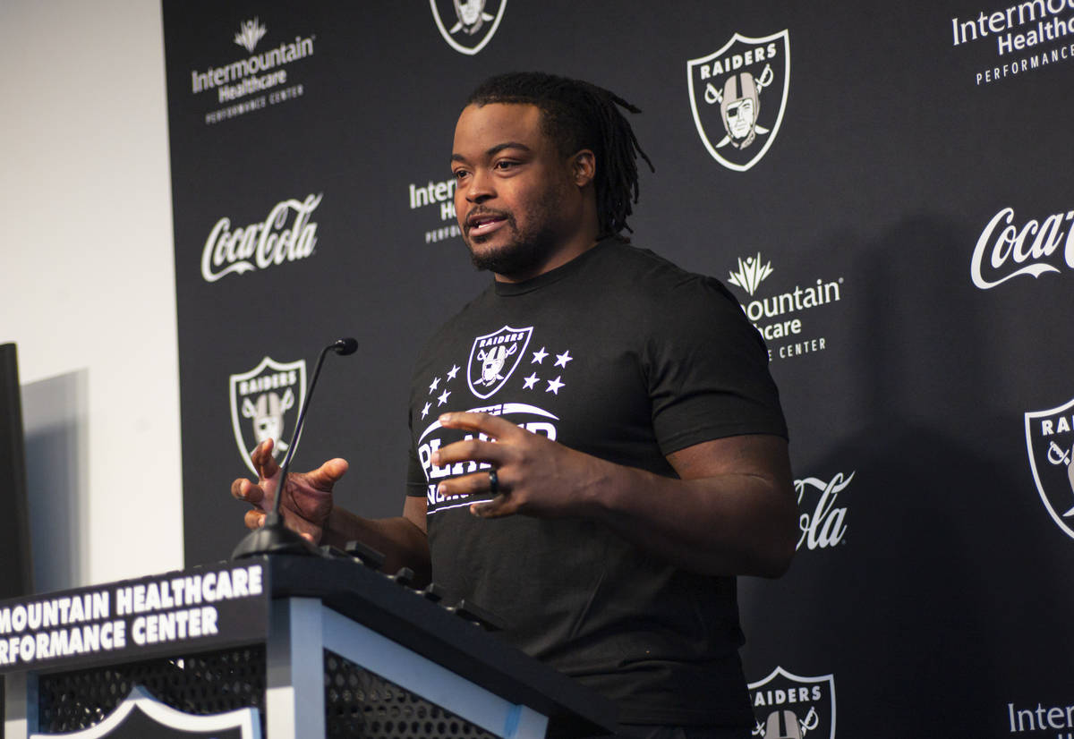 Raiders offensive guard John Simpson responds to questions during training camp at Raiders Head ...