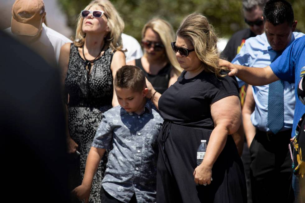 In this July 8, 2021, Christa Swanger, right, and her son Noah, 8, attend the funeral service f ...