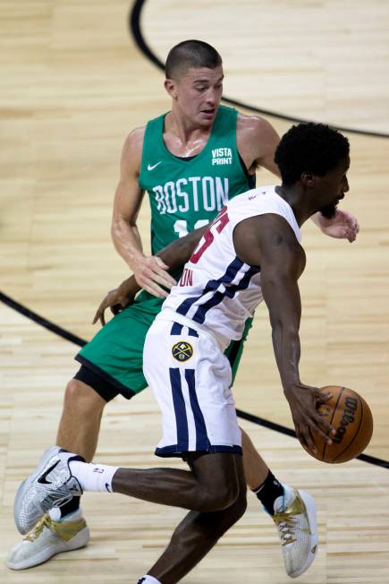 Boston Celtics Payton Pritchard (11) guards Denver Nuggets Daniel Hamilton (25) during the seco ...