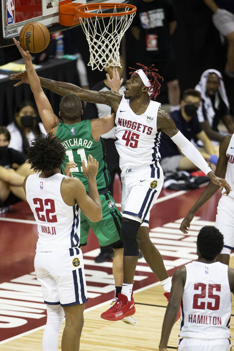 Denver Nuggets forward Zylan Cheatham (45) knocks down an attempted point by Boston Celtics gua ...