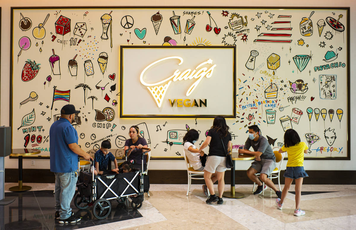 People sit outside of Craig's Vegan ice cream in The District at Resorts World Las Vegas. (Chas ...