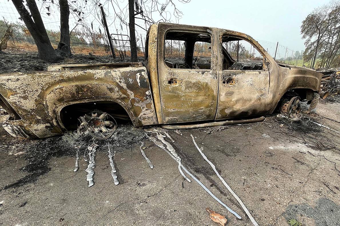 The melted metal from a pickup truck's rims ran down the driveway of this Chicago Park home aft ...