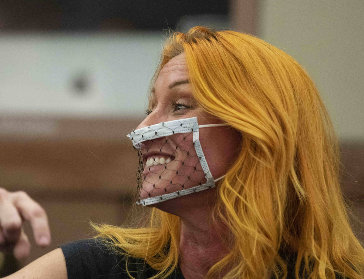 Stephanie Kinsley, protesting against a COVID-19 mandate, reacts during the Clark County Schoo ...