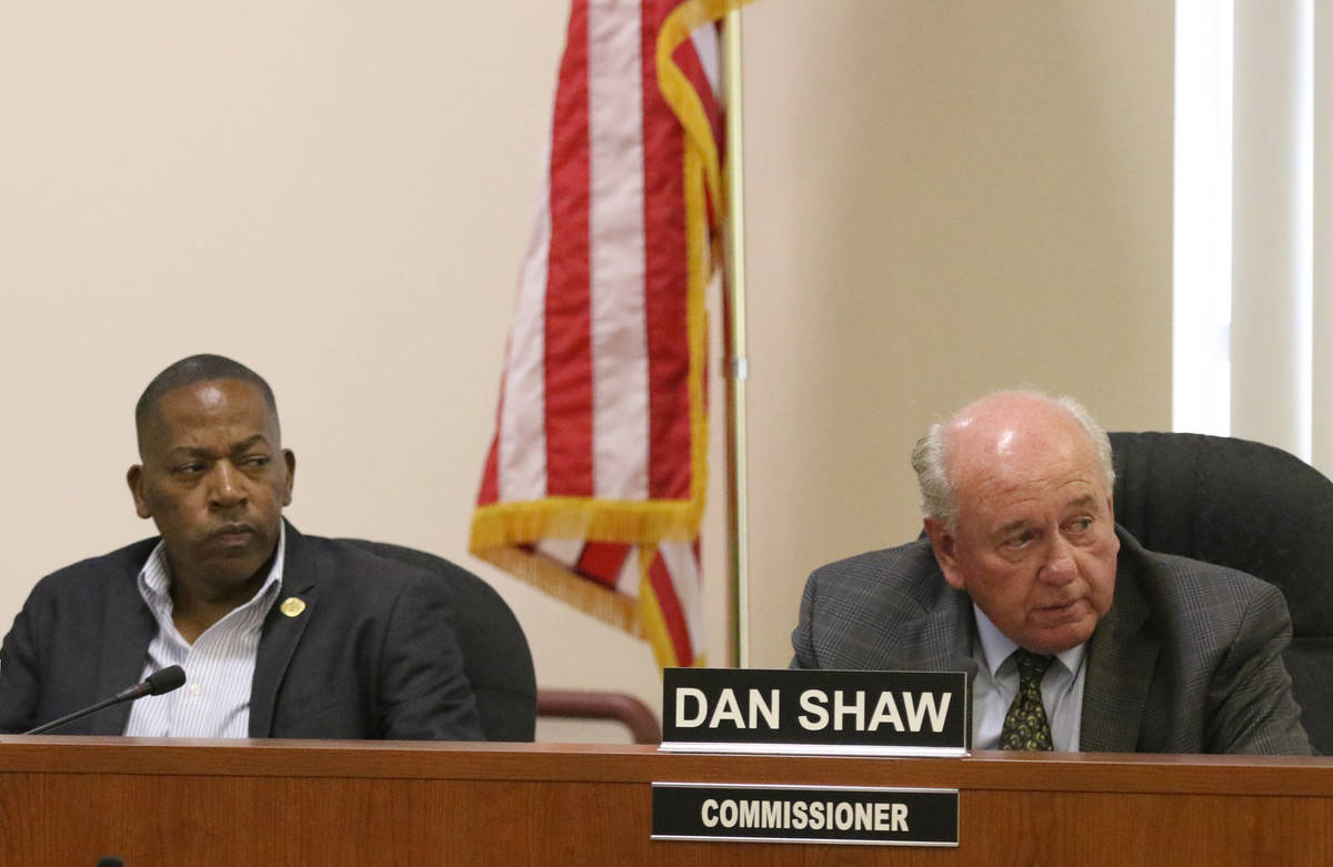 Southern Nevada Regional Housing Authority commissioners, Lawrence Weekly, left, and Dan Shaw t ...