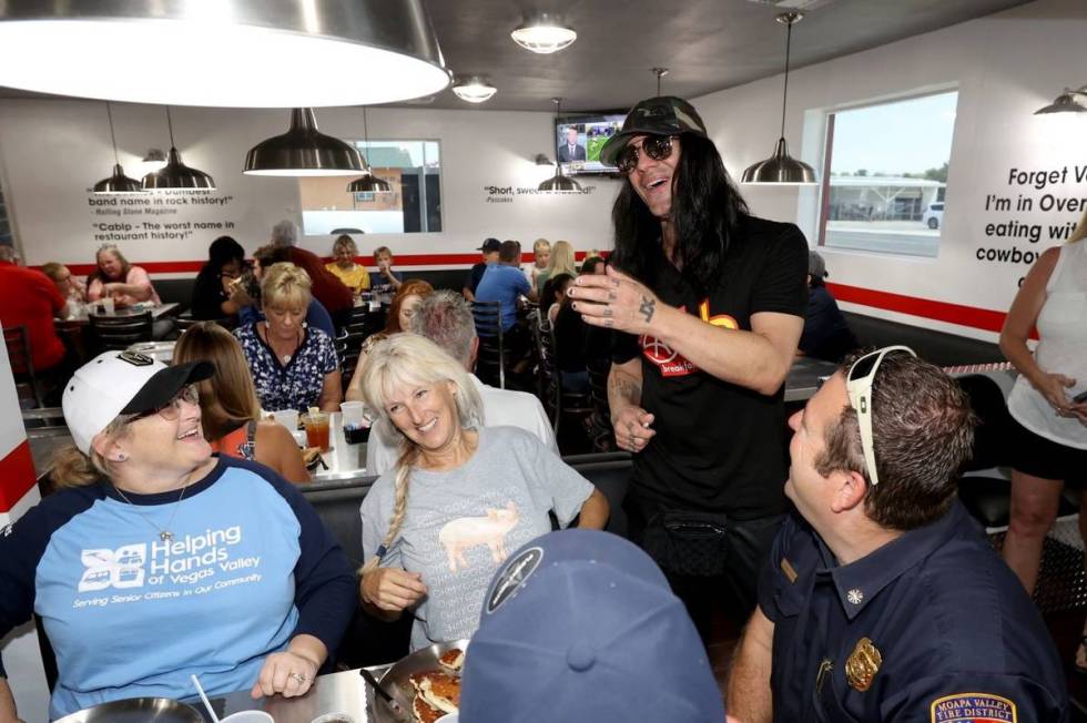 Criss Angel greets, from left, Shanna McPheters, Janice Ridondo, firefighter Greg Johnson and M ...