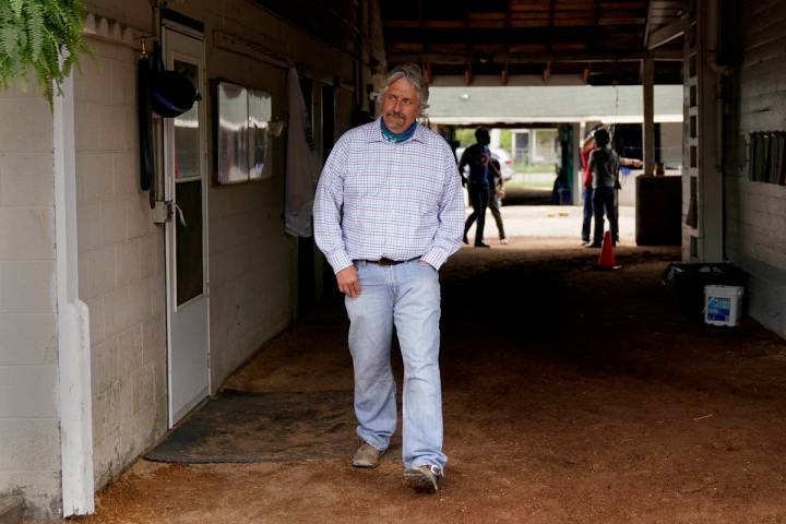 Trainer Steve Asmussen looks out from his barn after a workout at Churchill Downs Wednesday, Ap ...