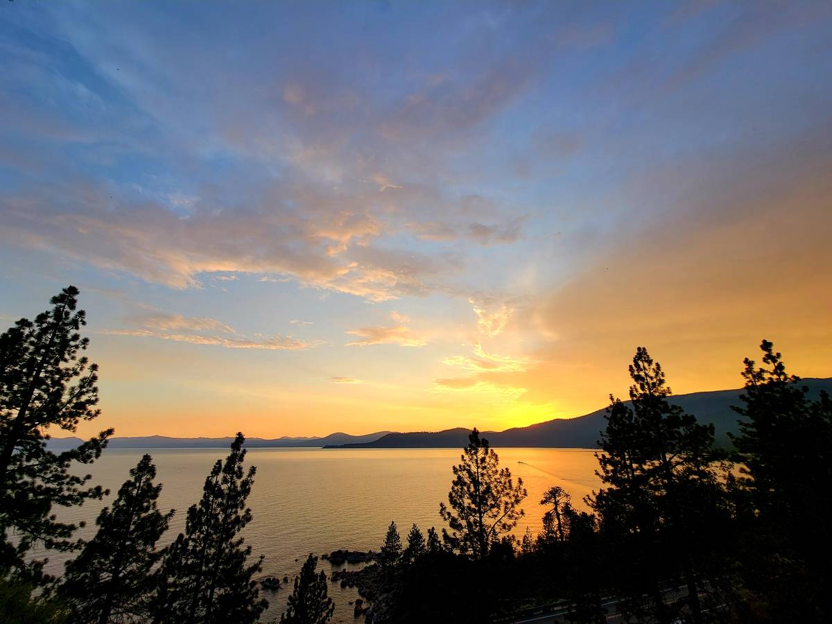 A Lake Tahoe sunset plays out above Incline Village in July as seen from the East Shore Tahoe T ...
