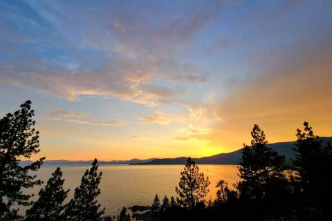 A Lake Tahoe sunset plays out above Incline Village in July as seen from the East Shore Tahoe T ...