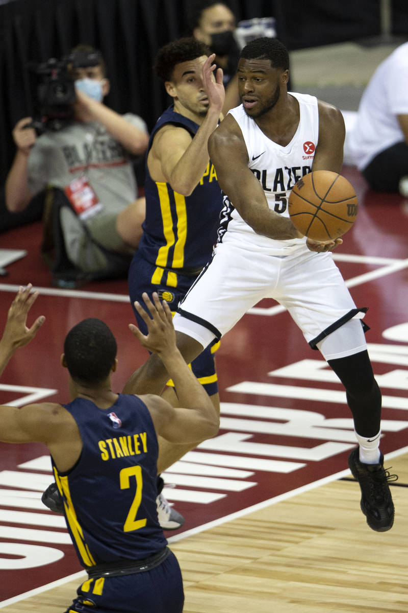 Portland Trail Blazers guard Emmanuel Mudiay (58) gains control of the ball surrounded by India ...