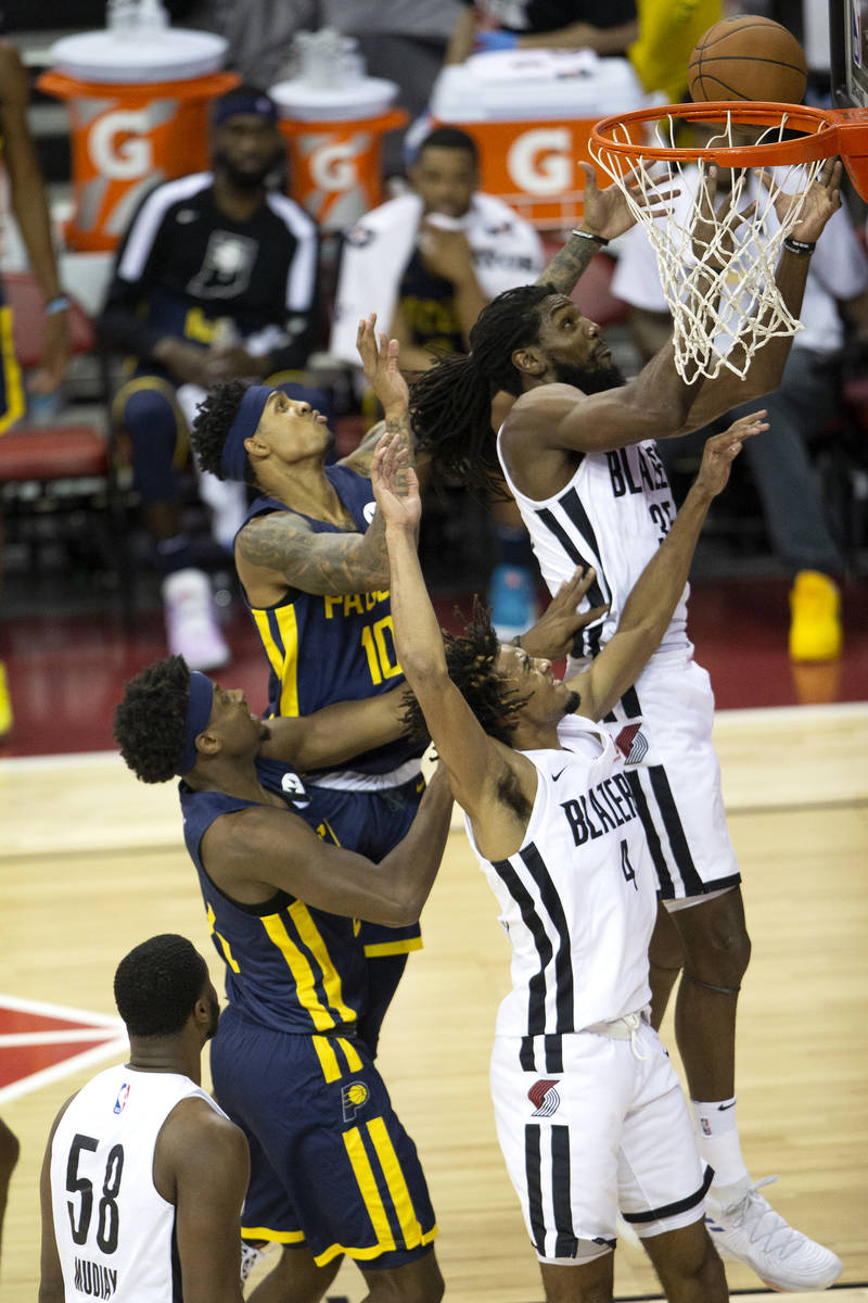 Portland Trail Blazers forward Kenneth Faried (35) jumps to intercept a layup by Indiana Pacers ...