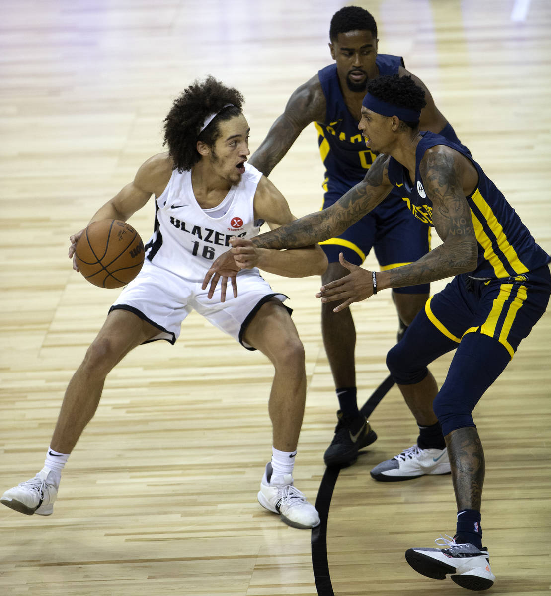 Portland Trail Blazers guard CJ Elleby (16) is guarded by Indiana Pacers forward Devin Robinson ...