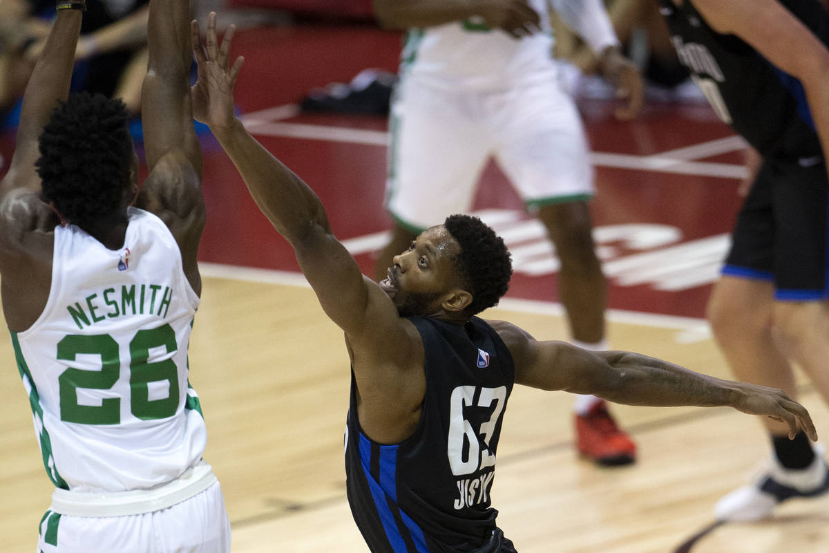 Orlando Magic forward Shakur Juiston (63) attempts to knock down a shot by Boston Celtics forwa ...
