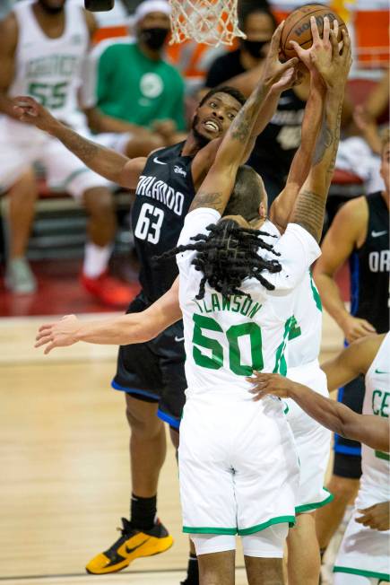 Orlando Magic forward Shakur Juiston (62) knocks down a shot by Boston Celtics guard Payton Pri ...