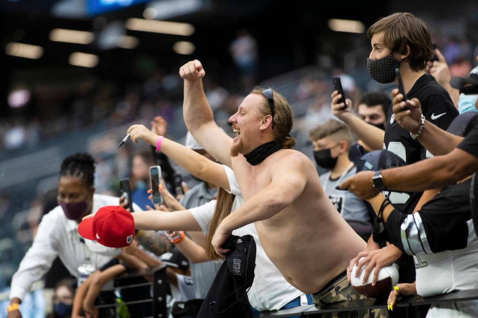 Raider fans take in the action during a special training camp practice for season ticket holder ...