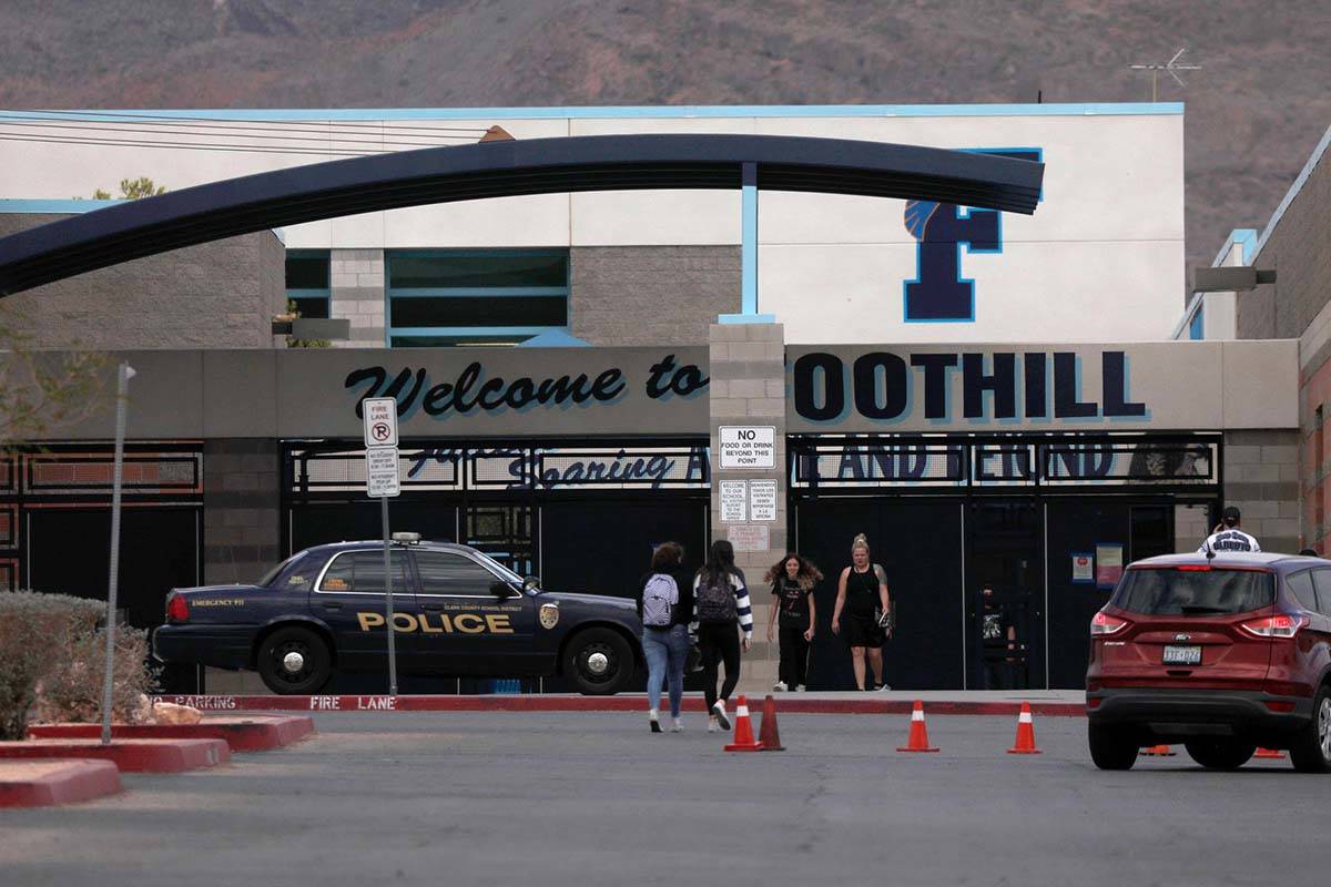 A Clark County School District police car is seen in front of the entrance of Foothill High Sch ...