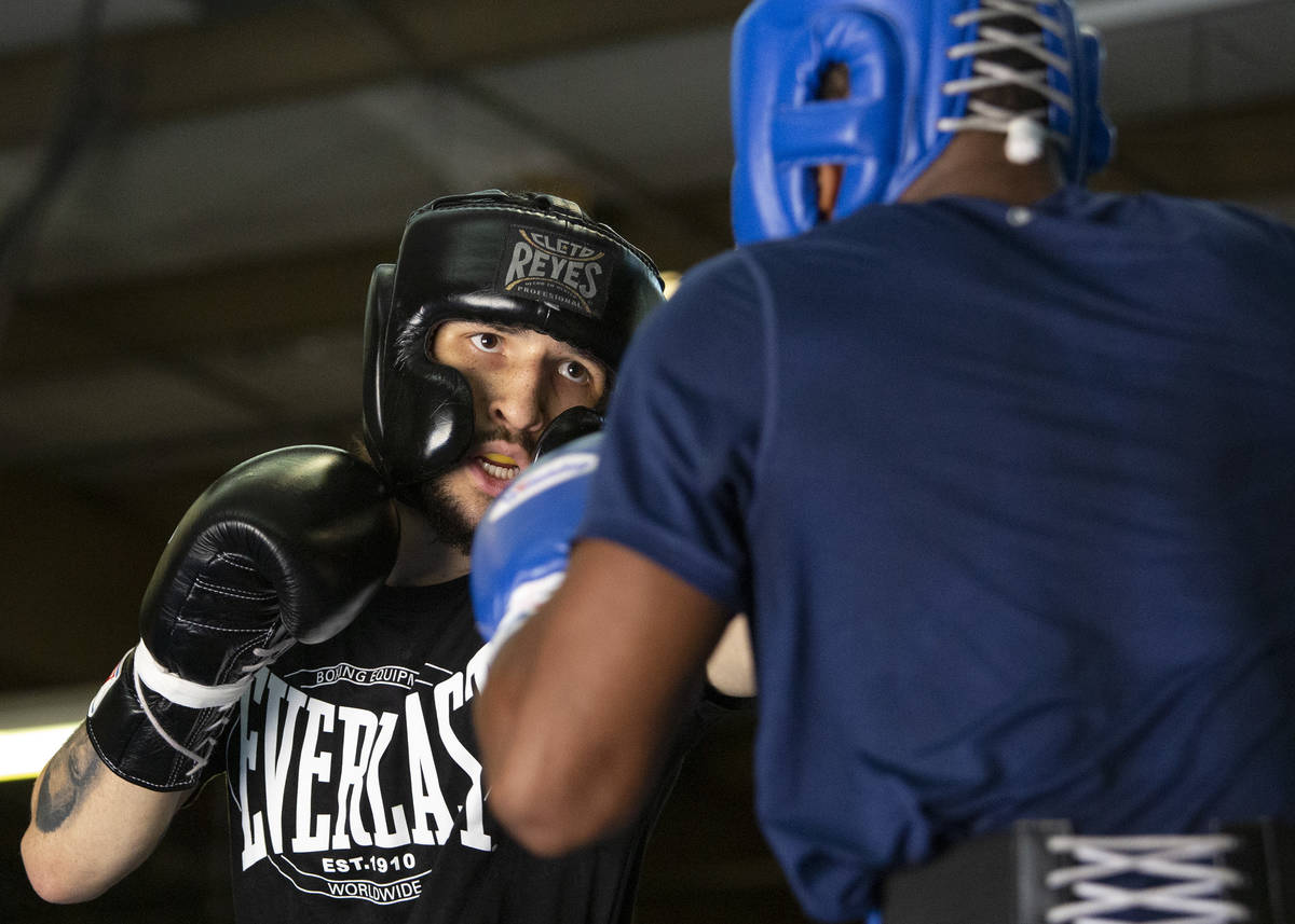 Nico Ali Walsh, left, boxes against Kamari Burnside during training at Top Rank Gym on Friday, ...