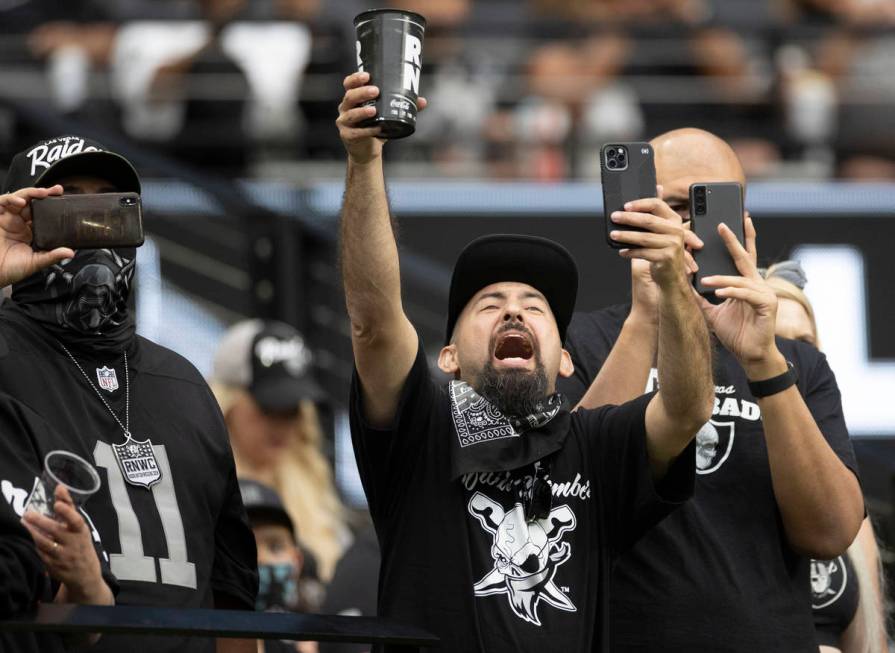 Raider fans take in the action during a special training camp practice for season ticket holder ...